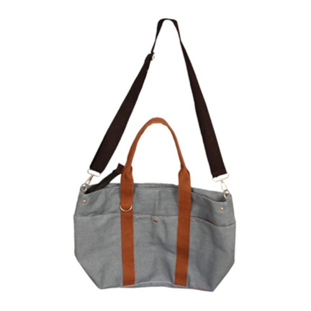 Beige jute tote bag with side pockets and wide brown handles